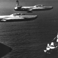 Two U.S. Air Force places from the Massachusetts Air National Guard pass over the Mayflower II in 1957.